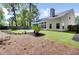 A well-maintained backyard with a lovely pool, manicured lawn, and attractive landscaping, perfect for outdoor enjoyment at 150 Sugar Magnolia Way, Charleston, SC 29414