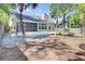 Backyard with pool, screened porch, and lush landscaping at 150 Sugar Magnolia Way, Charleston, SC 29414