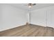 Bedroom with hardwood floors, a ceiling fan, and a white painted closet door at 150 Sugar Magnolia Way, Charleston, SC 29414