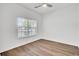 Bright and airy bedroom featuring a large window, hardwood floors, and neutral walls, offering a serene and comfortable living space at 150 Sugar Magnolia Way, Charleston, SC 29414