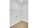 Clean and bright laundry room offers functionality with its crisp white walls, sleek flooring, and efficient shelving at 150 Sugar Magnolia Way, Charleston, SC 29414