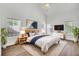 Bright primary bedroom with vaulted ceilings, three windows and a ceiling fan at 150 Sugar Magnolia Way, Charleston, SC 29414