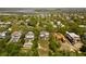 Expansive aerial view of a residential community featuring marsh views, mature trees, and luxurious homes, some with pools at 1651 Atlantic Ave, Sullivans Island, SC 29482
