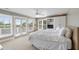 Bedroom with carpet, French doors to balcony, and white bookcase at 1651 Atlantic Ave, Sullivans Island, SC 29482