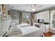 Comfortable bedroom featuring two beds, built in desk and cabinets, and a balcony at 1651 Atlantic Ave, Sullivans Island, SC 29482