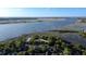 Sweeping aerial view of the riverfront, showcasing marshlands and a vast waterway leading to the ocean at 17 8Th Ave # 17G, Charleston, SC 29403