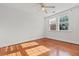 Bright bedroom with hardwood flooring, a ceiling fan, and two sunny windows at 17 8Th Ave # 17G, Charleston, SC 29403