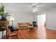Spacious living room with hardwood floors, comfortable seating, stylish decor, and bright, airy atmosphere at 17 8Th Ave # 17G, Charleston, SC 29403