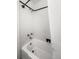A bright, white tiled shower and tub combination with vintage shower fixtures at 17 8Th Ave # 17G, Charleston, SC 29403