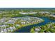 Stunning aerial view of a community nestled around a lake, surrounded by lush greenery and clear blue skies at 1700 Paradise Lake Dr, Mount Pleasant, SC 29464