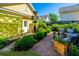 Inviting backyard with lush landscaping, a brick patio, and outdoor seating for relaxation and entertainment at 1700 Paradise Lake Dr, Mount Pleasant, SC 29464