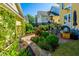 Picturesque backyard with well-maintained landscaping, a brick walkway, and comfortable outdoor seating area at 1700 Paradise Lake Dr, Mount Pleasant, SC 29464