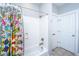 Clean bathroom showcasing a tiled shower/bathtub combination, colorful shower curtain, and well-lit space at 1700 Paradise Lake Dr, Mount Pleasant, SC 29464