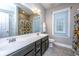Bright bathroom with double vanity, neutral color palette, large mirror, and a window for natural lighting at 1700 Paradise Lake Dr, Mount Pleasant, SC 29464