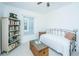 Sunlit bedroom showcases a bed, bookcase, and trunk, creating an inviting and functional space at 1700 Paradise Lake Dr, Mount Pleasant, SC 29464