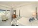 Bright bedroom with a four-poster bed, large windows, and neutral decor exudes comfort and style at 1700 Paradise Lake Dr, Mount Pleasant, SC 29464