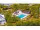 Aerial view of community pool area with lounge chairs, playground, and pergola providing a relaxing outdoor amenity at 1700 Paradise Lake Dr, Mount Pleasant, SC 29464