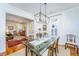 Stylish dining room with a glass-top table, elegant chairs, and hardwood floors, creating a perfect space at 1700 Paradise Lake Dr, Mount Pleasant, SC 29464
