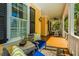 Relaxing front porch with comfortable seating, stylish decor, and a ceiling fan for outdoor enjoyment at 1700 Paradise Lake Dr, Mount Pleasant, SC 29464