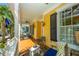 Inviting front porch featuring cozy seating, ceiling fans, and ample space for relaxing outdoors at 1700 Paradise Lake Dr, Mount Pleasant, SC 29464