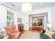 Cozy living room featuring comfortable seating, natural light, and hardwood floors, ideal for relaxation at 1700 Paradise Lake Dr, Mount Pleasant, SC 29464