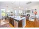 Bright open concept with kitchen, dinette and living room with hardwood floors and fireplace at 1700 Paradise Lake Dr, Mount Pleasant, SC 29464