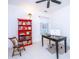 Well-lit home office with a red bookcase, work desk, and carpet, providing a comfortable workspace at 1700 Paradise Lake Dr, Mount Pleasant, SC 29464