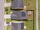Aerial view of homes with solar panels, driveways, green lawns, and fenced backyards in a suburban neighborhood at 187 Brittondale Rd, Summerville, SC 29485