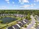 A residential community with a pond and green spaces surrounded by tree-lined streets and houses at 187 Brittondale Rd, Summerville, SC 29485