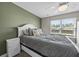 Comfortable bedroom with soft lighting, a ceiling fan, and a view of the outdoors, promoting relaxation at 187 Brittondale Rd, Summerville, SC 29485