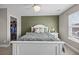 Bright bedroom with a neutral palette, featuring a ceiling fan and an organized walk-in closet at 187 Brittondale Rd, Summerville, SC 29485