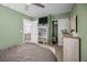 Bedroom view with a television over a bookshelf, with glimpses of a closet and living area at 187 Brittondale Rd, Summerville, SC 29485