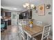 Cozy dining room featuring dark cabinetry, and an open kitchen, perfect for entertaining guests at 187 Brittondale Rd, Summerville, SC 29485