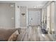 Bright foyer with wood-like floors, and a modern white door with colorful glass accent at 187 Brittondale Rd, Summerville, SC 29485