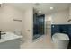 Modern bathroom featuring a glass-enclosed shower, soaking tub, and sleek fixtures at 1897 Halo Ln, Charleston, SC 29407
