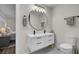 Stylish bathroom with a double vanity, modern lighting, and contemporary fixtures, adjacent to the bedroom at 1897 Halo Ln, Charleston, SC 29407