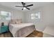 Cozy bedroom with hardwood floors, two windows and a ceiling fan at 1897 Halo Ln, Charleston, SC 29407