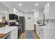 Modern kitchen with white cabinets, stainless steel appliances, and a bright, functional design at 1897 Halo Ln, Charleston, SC 29407