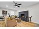 Cozy living room with a modern fireplace, hardwood floors, and stylish furnishings, perfect for relaxation at 1897 Halo Ln, Charleston, SC 29407