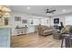 Open-concept living room featuring hardwood floors, modern decor, and a seamless flow to the dining area at 1897 Halo Ln, Charleston, SC 29407