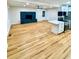 Open living space features wood floors, a modern fireplace and a modern kitchen at 1897 Halo Ln, Charleston, SC 29407