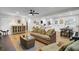 Inviting living room with hardwood floors, a wicker sofa, and an open layout that leads to the kitchen at 1897 Halo Ln, Charleston, SC 29407