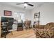 Bright home office with two work stations, a ceiling fan, and wood flooring at 1897 Halo Ln, Charleston, SC 29407