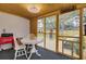 Enclosed sun room with wood walls, wood ceiling, and a view of the backyard at 1897 Halo Ln, Charleston, SC 29407