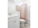 Cozy bathroom featuring a white vanity, framed art and shower with a patterned curtain at 195 Belfort Pl, Summerville, SC 29486