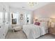 Charming bedroom with plush carpet, an accent wall, bright windows and elegant decor at 195 Belfort Pl, Summerville, SC 29486
