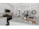 Bright kitchen featuring stainless steel appliances, white cabinets, a spacious island, and views of the dining area at 195 Belfort Pl, Summerville, SC 29486