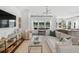 Inviting living room with modern furniture, natural light, and a scenic view of the lake at 195 Belfort Pl, Summerville, SC 29486