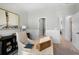 Well-lit home office with shiplap walls, modern desk, and decor with a view of the bathroom at 195 Belfort Pl, Summerville, SC 29486