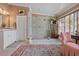 Elegant bathroom with a glass-enclosed shower, vanity, and decorative tile flooring at 2 Bedons Aly, Charleston, SC 29401